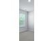 Bedroom featuring a window with a view of green trees and neutral walls and carpet at 355 Willows Crescent Dr, Moncks Corner, SC 29461