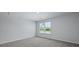 Bright bedroom featuring a window, neutral walls and carpet at 355 Willows Crescent Dr, Moncks Corner, SC 29461