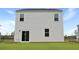 Exterior rear view of home with green grass and a white siding at 357 Willows Crescent Dr, Moncks Corner, SC 29461