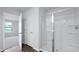 Bright bathroom featuring a glass-enclosed shower and white cabinets at 357 Willows Crescent Dr, Moncks Corner, SC 29461