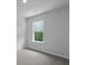 Well lit bedroom with neutral carpet, window, and view of outside greenery at 357 Willows Crescent Dr, Moncks Corner, SC 29461