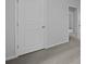 Hallway featuring a grey carpet and white walls leading to an adjacent room at 357 Willows Crescent Dr, Moncks Corner, SC 29461