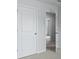 Hallway featuring a grey carpet and white doors leading to an adjacent room at 357 Willows Crescent Dr, Moncks Corner, SC 29461