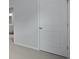 Hallway featuring a grey carpet and white doors leading to an adjacent bathroom at 357 Willows Crescent Dr, Moncks Corner, SC 29461