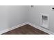 Functional laundry area with dark wood flooring and utility connections at 357 Willows Crescent Dr, Moncks Corner, SC 29461