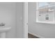 Half bathroom with pedestal sink and a window view at 369 Willows Crescent Dr, Moncks Corner, SC 29461