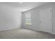 Neutral bedroom with soft carpet, a window and a door at 369 Willows Crescent Dr, Moncks Corner, SC 29461