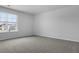 Bright bedroom features plush gray carpet and a large window at 369 Willows Crescent Dr, Moncks Corner, SC 29461