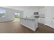 Eat-in kitchen offers modern stainless appliances, granite countertops, and sliding glass doors to the backyard at 405 Peachwood Ln, Moncks Corner, SC 29461