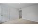 Bright bedroom with neutral carpet, a closet, and a white door at 361 Willows Crescent Dr, Moncks Corner, SC 29461