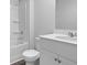 A stylish bathroom boasts a sleek white vanity, a toilet and a bathtub with shower at 373 Willows Crescent Dr, Moncks Corner, SC 29461