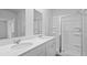 This bathroom features double sinks, a glass enclosed shower, and wood flooring at 373 Willows Crescent Dr, Moncks Corner, SC 29461