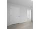 This bedroom features neutral carpet, bright white walls, and two white doors at 373 Willows Crescent Dr, Moncks Corner, SC 29461