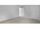 This bedroom features neutral carpet, bright white walls, and two white doors at 373 Willows Crescent Dr, Moncks Corner, SC 29461