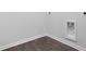 A well lit laundry room shows dark vinyl wood-look floors and white walls with hook ups at 373 Willows Crescent Dr, Moncks Corner, SC 29461