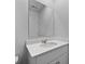 Bathroom vanity featuring a white sink, white countertop, and a large mirror at 374 Willows Crescent Dr, Moncks Corner, SC 29461