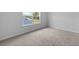 Bedroom featuring neutral carpet and a window that provides natural light at 374 Willows Crescent Dr, Moncks Corner, SC 29461