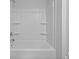 A clean and modern shower featuring a tub and built-in shelves at 374 Willows Crescent Dr, Moncks Corner, SC 29461