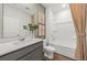 Well-lit bathroom with stylish vanity, framed mirror, shower-tub combo, and modern fixtures at 190 West Bradford Pointe Dr, Summerville, SC 29486