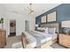 Beautifully staged main bedroom featuring a blue accent wall and abundant natural light at 190 West Bradford Pointe Dr, Summerville, SC 29486