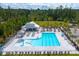Aerial view of a community pool with plenty of seating and a beautiful surrounding landscape at 190 West Bradford Pointe Dr, Summerville, SC 29486