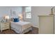 Cozy bedroom with a double bed, light colored walls, and hardwood floors at 181 Carolina Groves Blvd, Moncks Corner, SC 29461