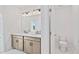 Bathroom featuring a double vanity, toilet, and a doorway leading to another room at 1094 Glenshaw St, North Charleston, SC 29405