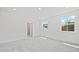 Spacious bedroom with carpet, white walls, and an open doorway to the bathroom at 1094 Glenshaw St, North Charleston, SC 29405
