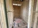 Tight view of an unfinished room featuring exposed framing, bare subfloor, and plumbing installed along the wall at 1709 Vireo Ct, Johns Island, SC 29455