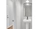 Powder room with pedestal sink and contemporary mirror at 166 Cantona Dr, Summerville, SC 29483