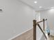 Upstairs hallway with carpeted floor and wooden railing at 166 Cantona Dr, Summerville, SC 29483
