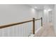 Upstairs hallway with carpeted floor and wooden railing at 166 Cantona Dr, Summerville, SC 29483