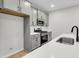 Modern kitchen with gray cabinets and quartz countertops at 166 Cantona Dr, Summerville, SC 29483