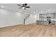Open concept living room featuring hardwood floors and a modern kitchen at 166 Cantona Dr, Summerville, SC 29483