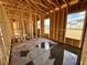 New home construction showing interior framing, windows, and concrete floor at 319 Trailmore Ln, Summerville, SC 29486