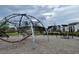 Community playground featuring climbing structure and swings at 319 Trailmore Ln, Summerville, SC 29486