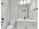 Bathroom with shower, toilet, vanity, and mirror, all with modern finishes at 4 Wappoo Trace Ln, Summerville, SC 29486
