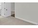 Bedroom with neutral carpet, opening into bathroom with tile floor and white vanity at 4 Wappoo Trace Ln, Summerville, SC 29486