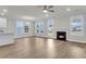 Open floor plan with a modern fireplace and windows with plenty of natural light at 4 Wappoo Trace Ln, Summerville, SC 29486