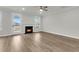 Cozy living room with wood-look floors and a fireplace at 4 Wappoo Trace Ln, Summerville, SC 29486