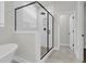 Walk-in shower with glass enclosure, white subway tile, and matte black hardware at 4 Wappoo Trace Ln, Summerville, SC 29486