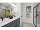 Elegant bathroom featuring double vanity, quartz countertops, modern lighting, and a sleek glass-enclosed shower at 11 Wappoo Trace Ln, Summerville, SC 29486