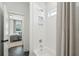 Bright bathroom with white subway tile shower and view to adjacent bedroom at 11 Wappoo Trace Ln, Summerville, SC 29486