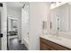 Modern bathroom with sleek vanity, stylish fixtures, and a view into the adjacent bedroom at 11 Wappoo Trace Ln, Summerville, SC 29486