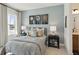 Well-lit bedroom with blue walls, neutral furnishings, and themed decor at 11 Wappoo Trace Ln, Summerville, SC 29486