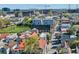 An aerial view of a neighborhood street with colorful roofs, nearby buildings, and an interesting bridge in the distance at 59 Ashe St, Charleston, SC 29403