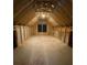 Unfinished attic space with exposed wooden beams and a window, ready for customization at 9 Wappoo Trace Ln, Summerville, SC 29486