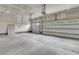 Bright, clean garage with two white doors, automatic opener, and plenty of space for vehicles and storage at 9 Wappoo Trace Ln, Summerville, SC 29486