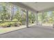 Inviting screened porch offering serene views of lush greenery and an outdoor living space at 9 Wappoo Trace Ln, Summerville, SC 29486