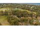An aerial view of the community showcasing lush green spaces, golf course and multiple ponds at 818 Club Cottage Court, Edisto Beach, SC 29438